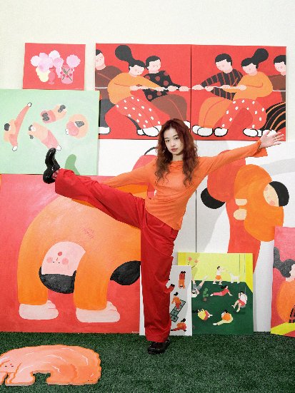 A person standing in front of a wall of paintings

AI-generated content may be incorrect.