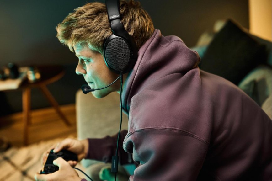 A person wearing headphones and holding a game controller

AI-generated content may be incorrect.