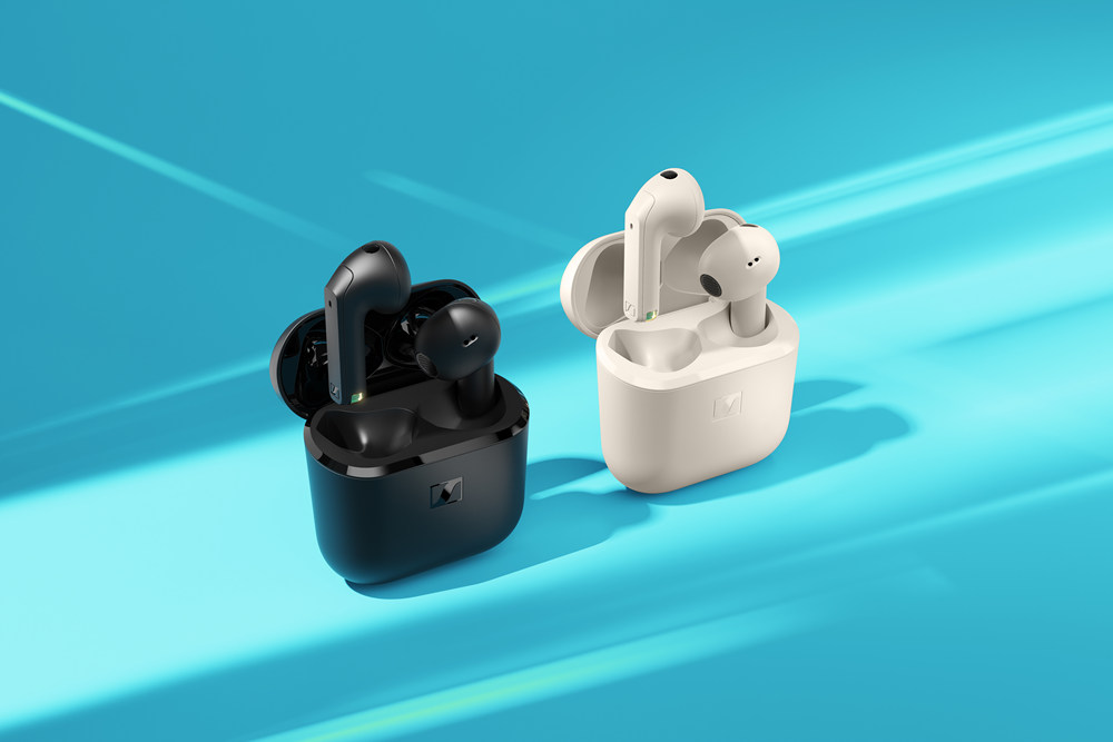 A black and white wireless earbuds
Description automatically generated